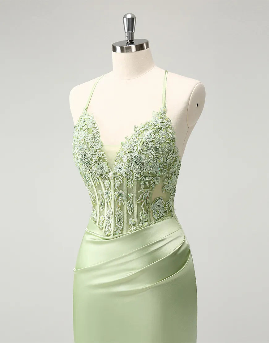 Front view of a green beaded V-neck dress.