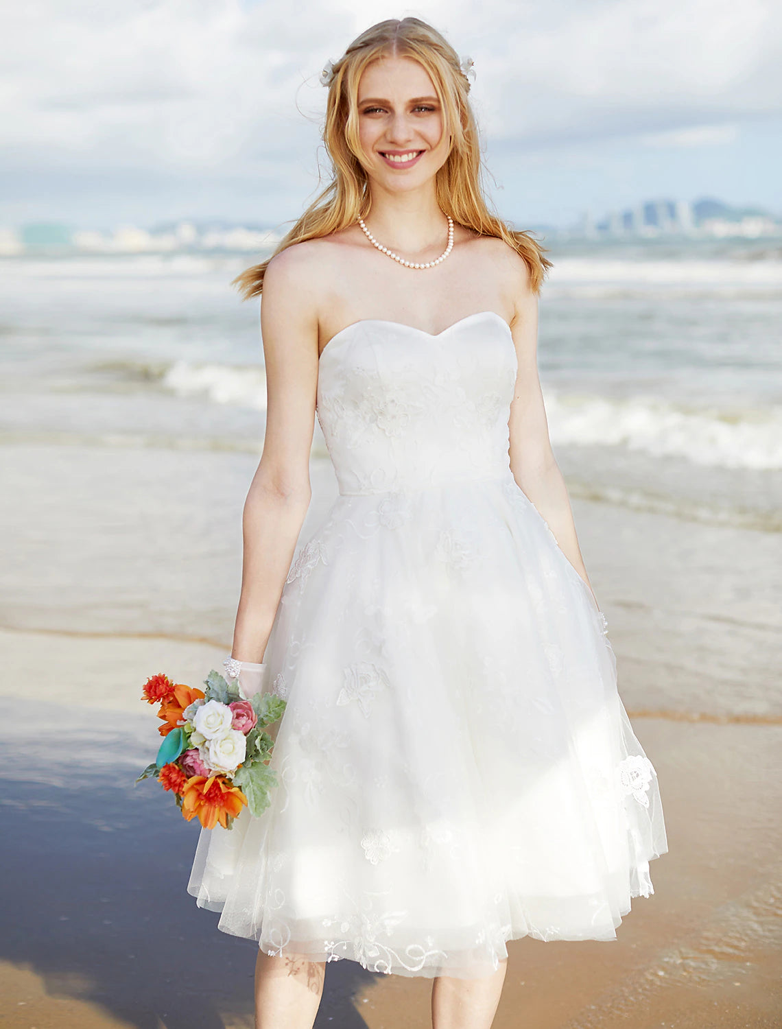 Intricate lace detail on the bodice of a strapless wedding dress.
