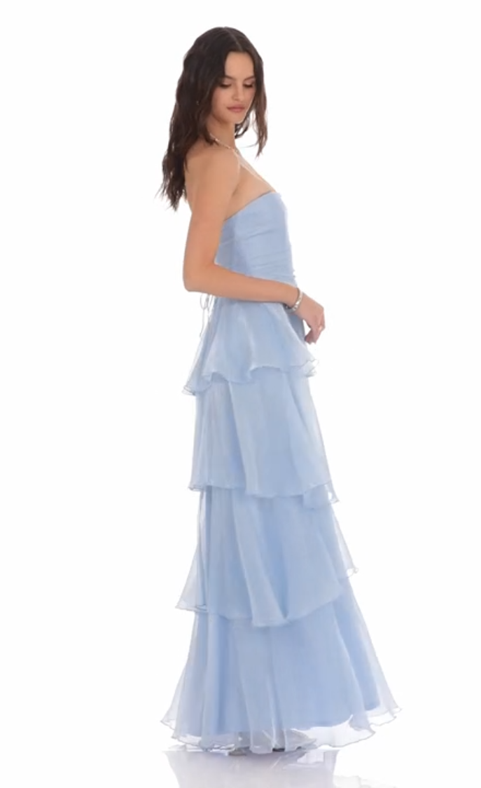 Close-up of the corset bodice and ruffle details on the sky blue maxi dress.