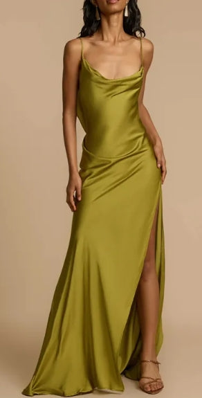 Side view of the bias cut maxi dress with drape and ruffle details.