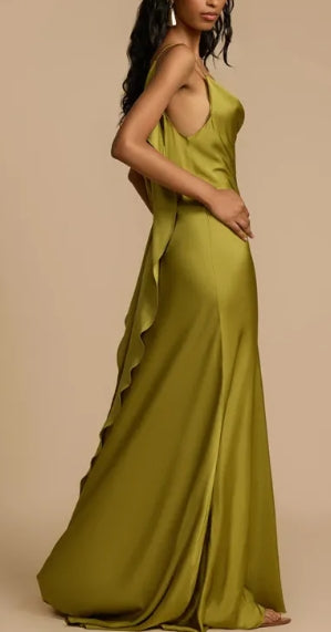 Back view showcasing the ruffle and drape of the backless maxi dress.