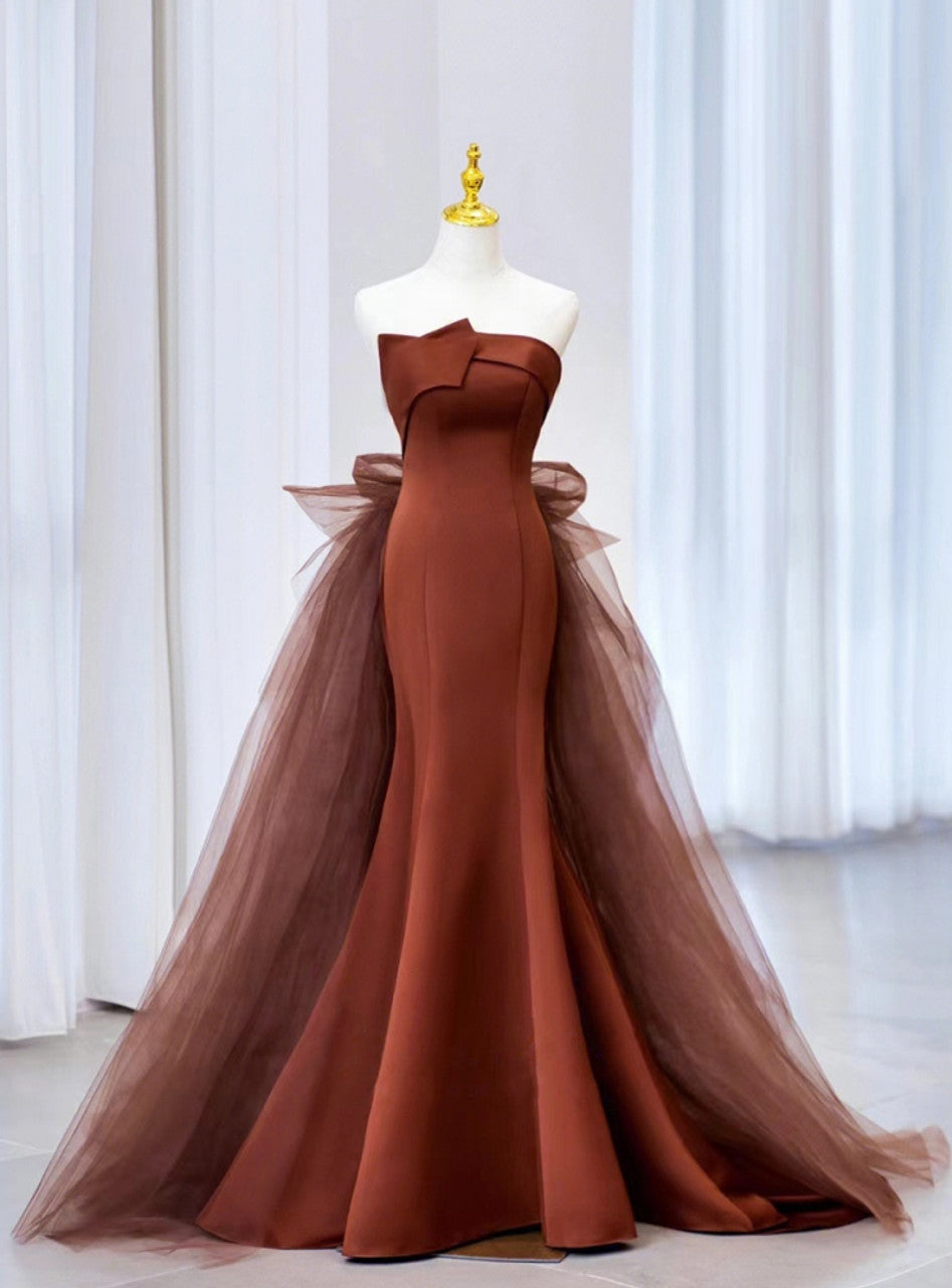 Elegant strapless tulle mermaid prom dress on a model.