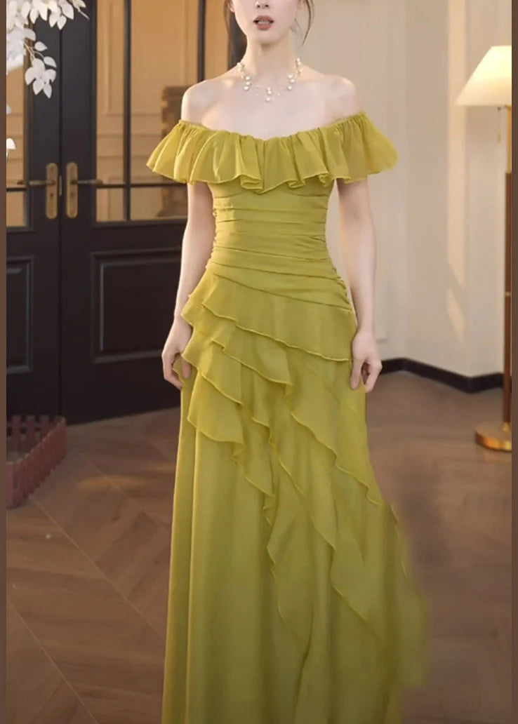 Back view of a model in a green square collar ruffled chiffon midi dress.