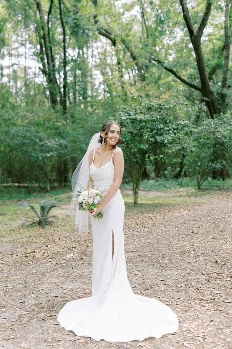 Elegant mermaid satin wedding dress with cowl neck and front slit.