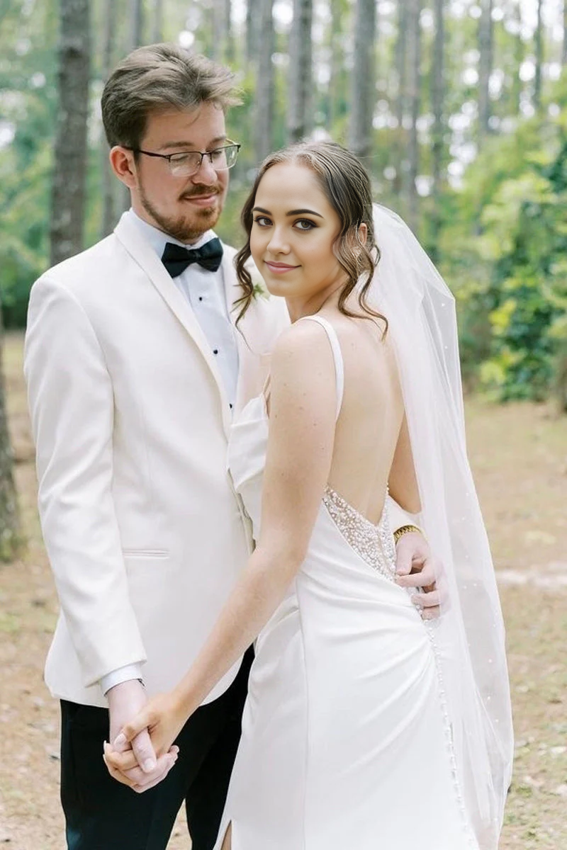 Back view of the mermaid satin wedding dress with a graceful train.