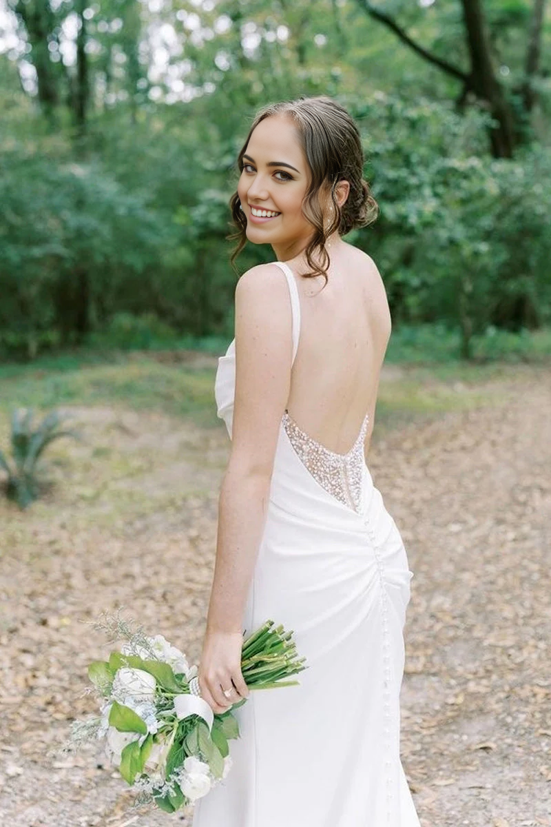 Close-up of the cowl neckline on the satin mermaid wedding dress.