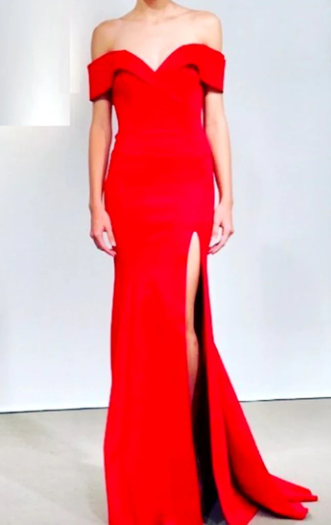 Woman wearing an elegant mermaid off-shoulder prom dress.
