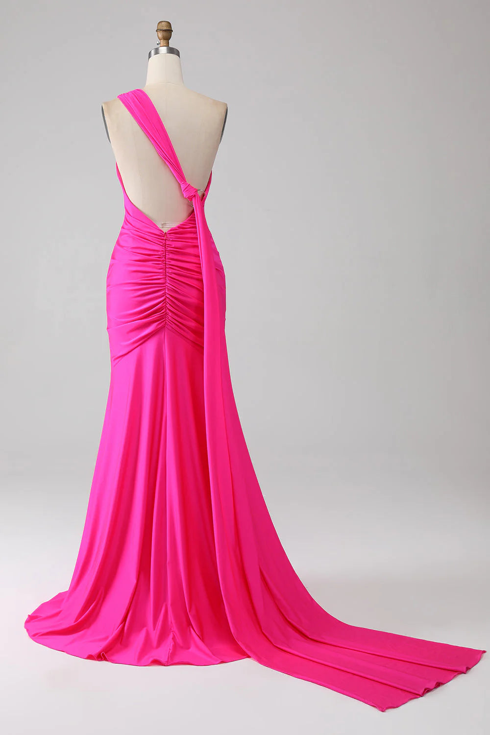 Back view of hot pink mermaid one-shoulder long prom dress.