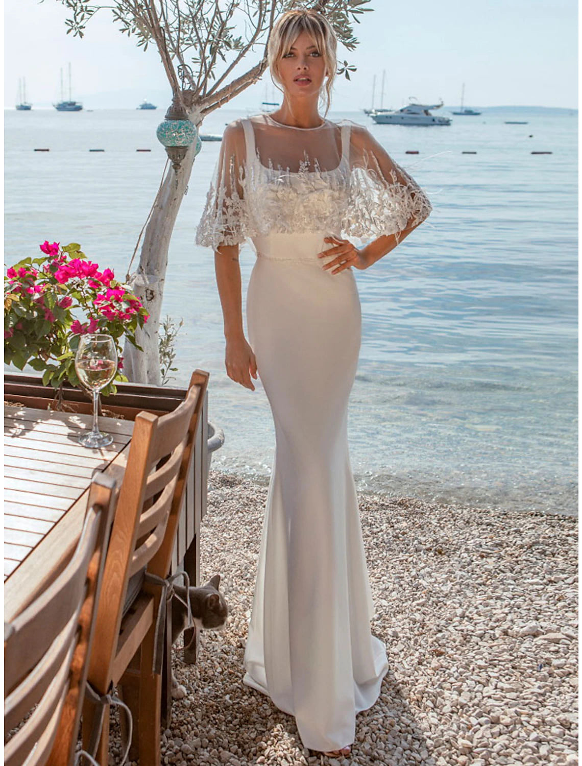 Elegant mermaid satin wedding dress with square neck and open back, featuring a sweep train.
