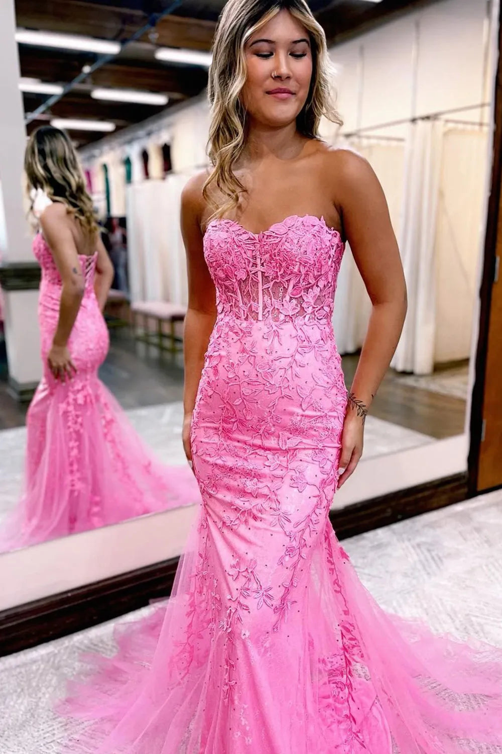 Side view of a mermaid formal dress, showcasing the silhouette and appliques.