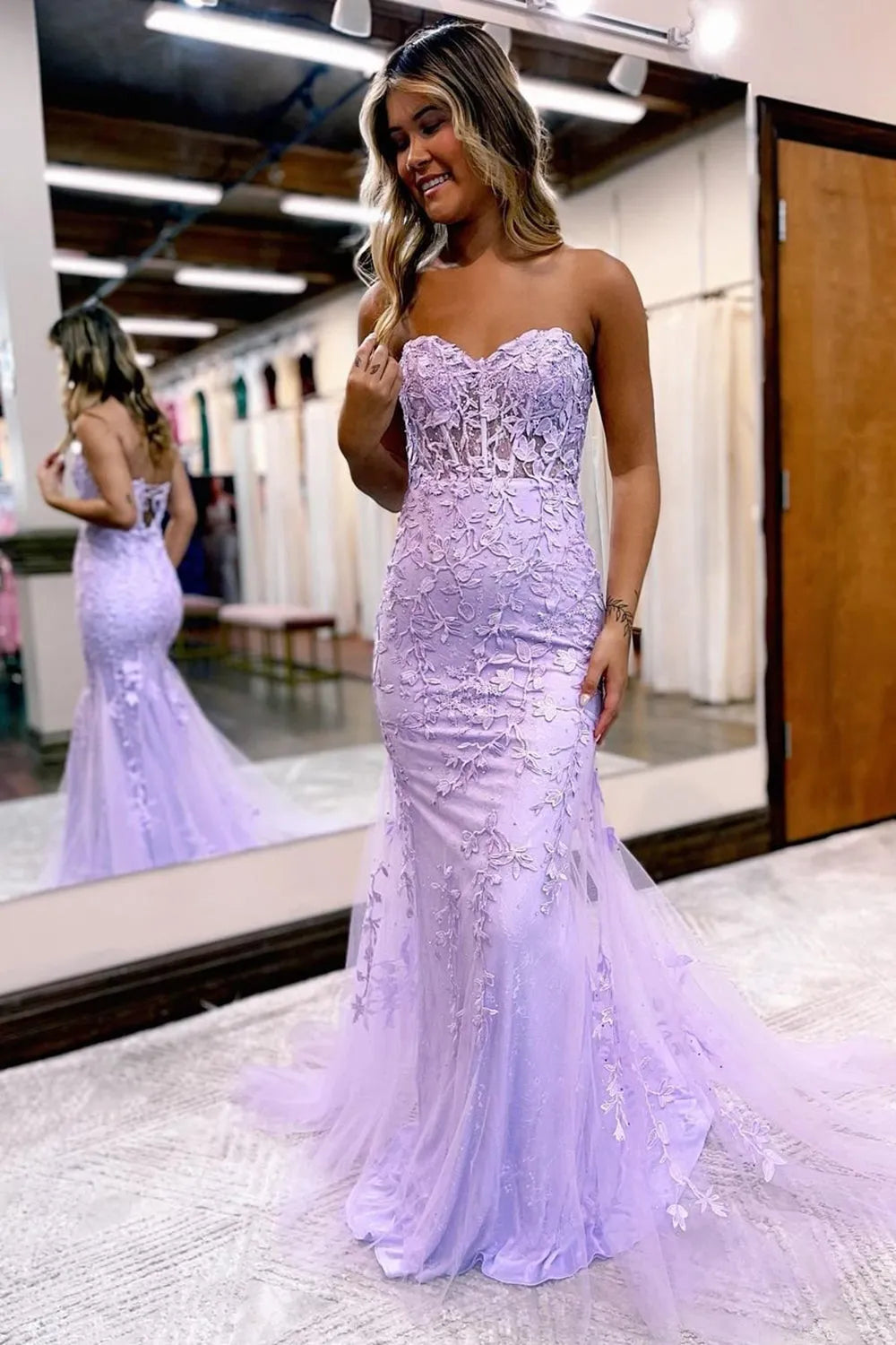 Close-up of appliques on the back of a sweetheart neck mermaid gown.
