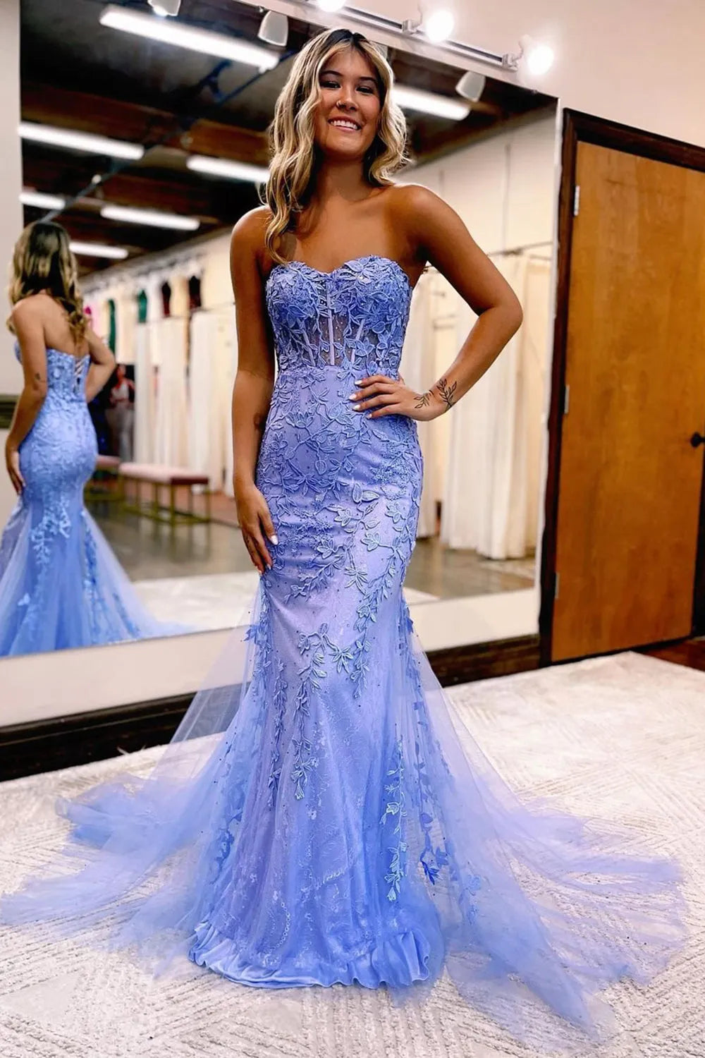 Model wearing a mermaid style formal dress, perfect for special occasions.