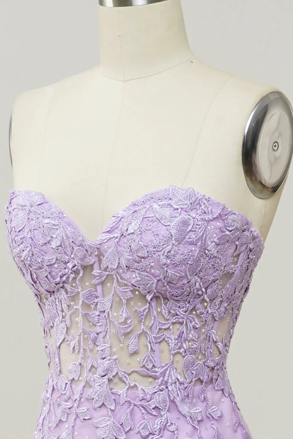 Sweetheart neckline and delicate appliques on a mermaid prom dress.