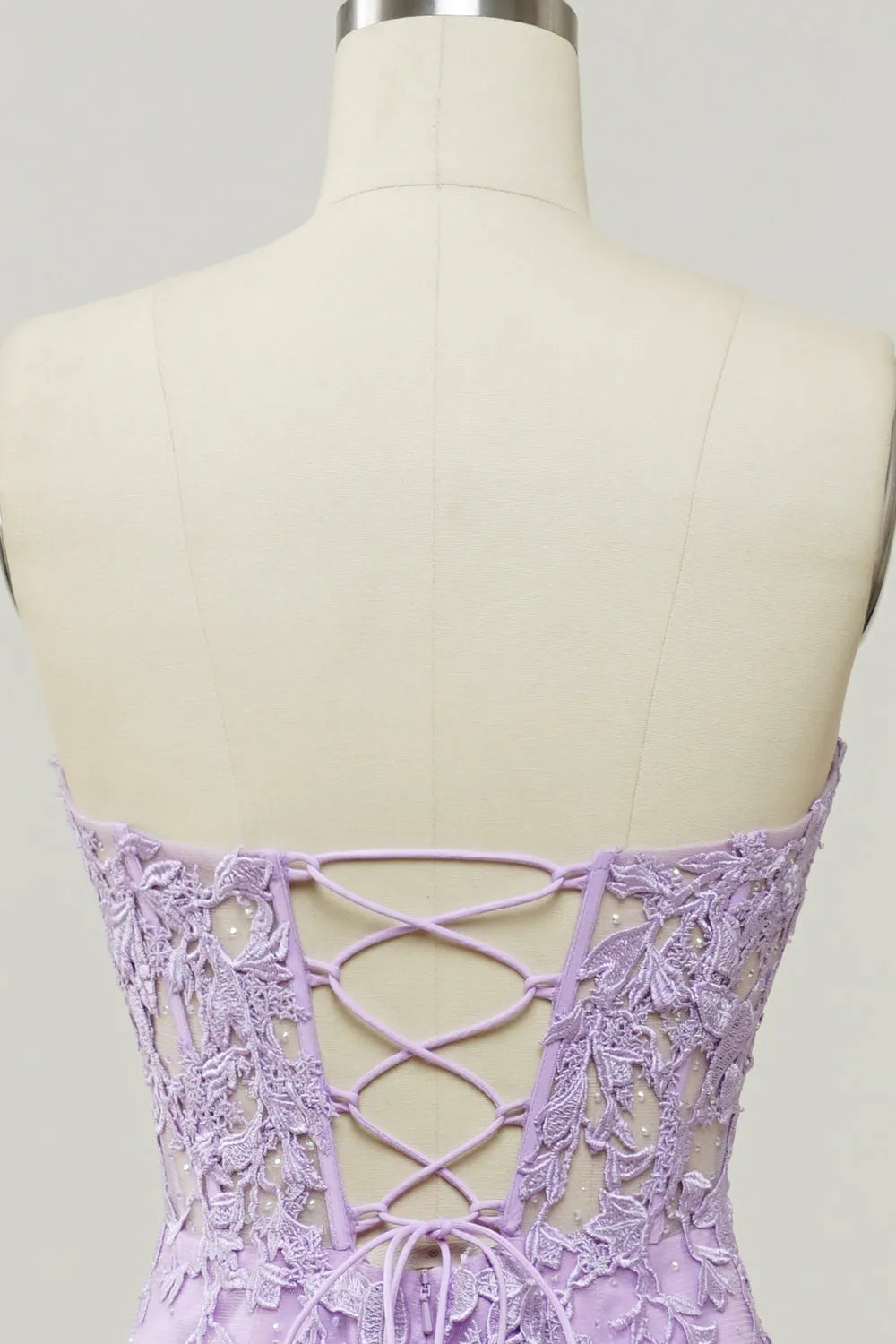 Flowing mermaid gown with appliques, ideal for dancing at prom.