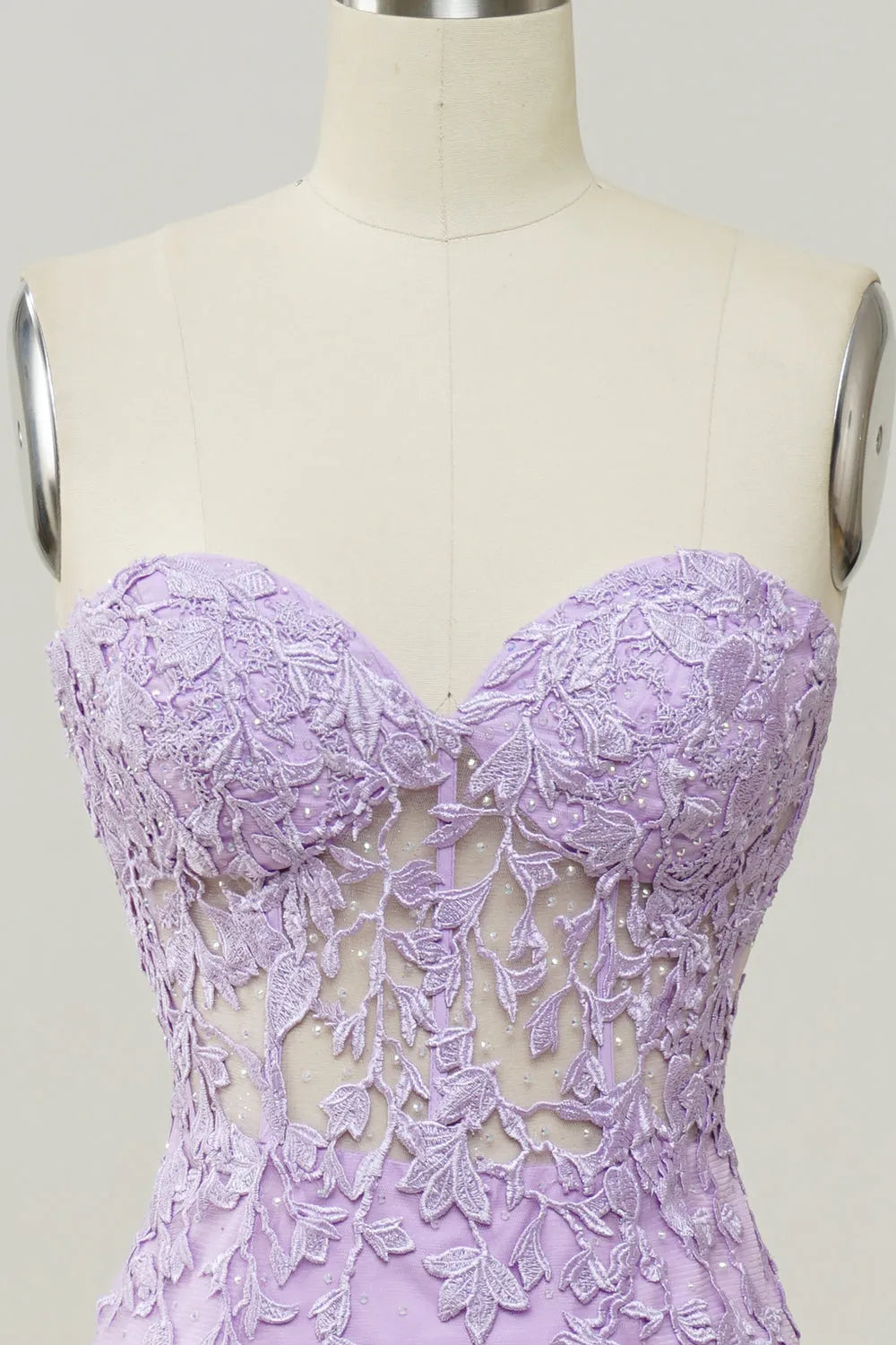 Mermaid formal gown with a subtle train and detailed appliques.