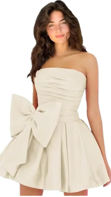 Model wearing a chic minimalist A-line strapless short homecoming dress with ruched and ruffled details.