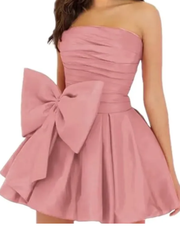 Close-up of the ruched bodice and ruffled skirt of the A-line strapless dress.
