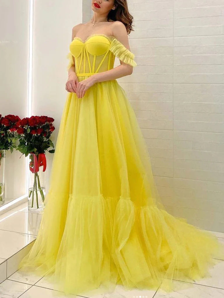Close-up of the delicate off-shoulder neckline and bodice details of the tulle prom dress.