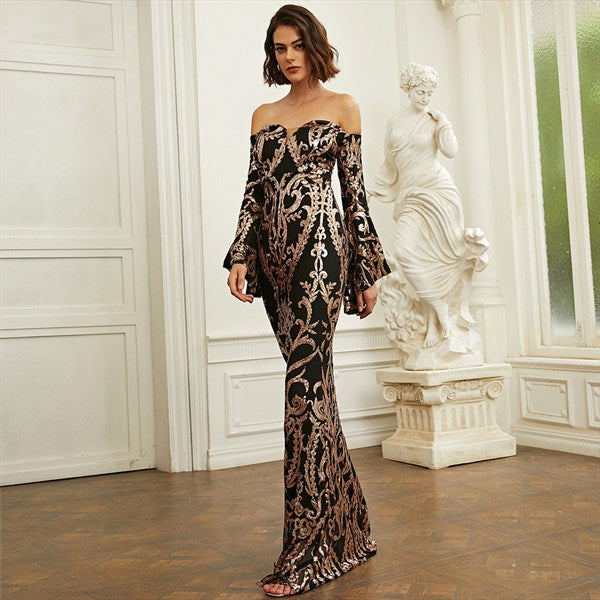 Model wearing a black and gold sequin off-shoulder A-line prom dress with long sleeves.