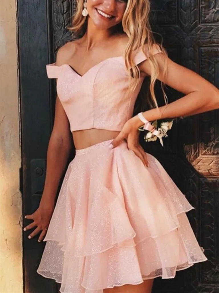Model wearing a chic off-shoulder two-piece short A-line dress, perfect for prom or homecoming.