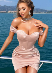 Close-up of the one-shoulder neckline and fitted bodice of the dress.