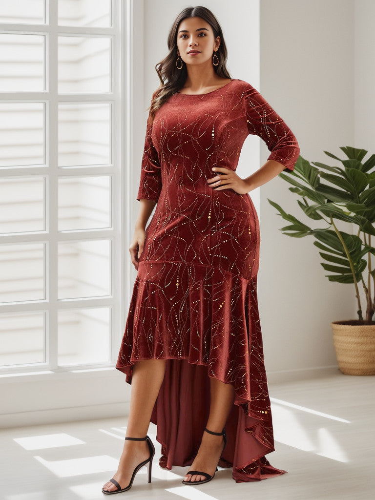 Side view of a plus size model in a brick red velvet bodycon high-low dress.