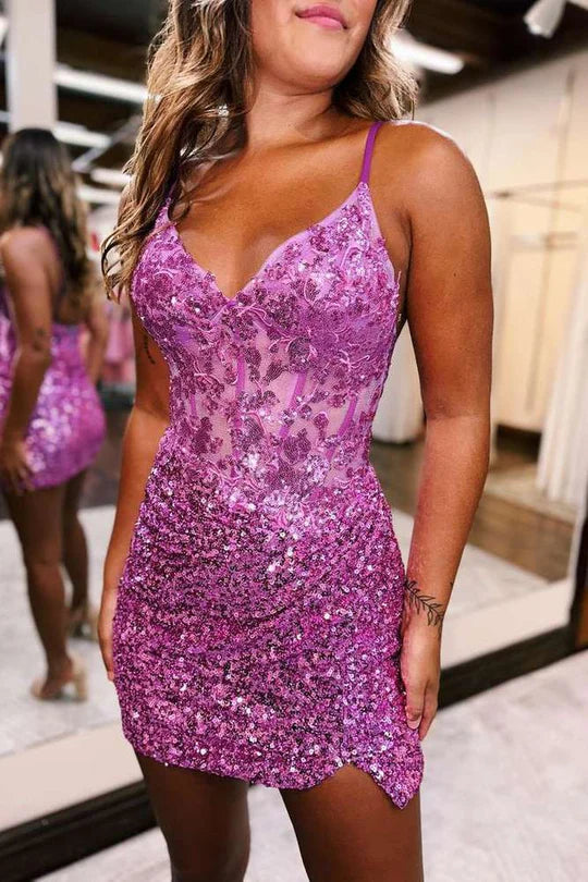 Side profile of a model in the chic sequined sweetheart mini dress, highlighting its fit.