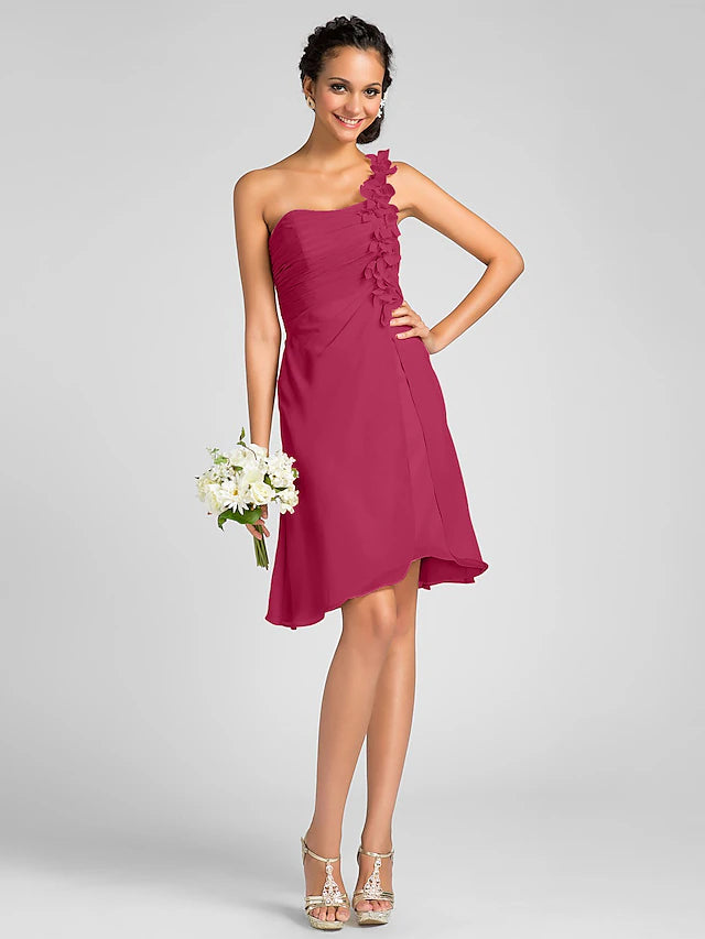 Close-up of the flower detail and side draping on a chiffon dress.
