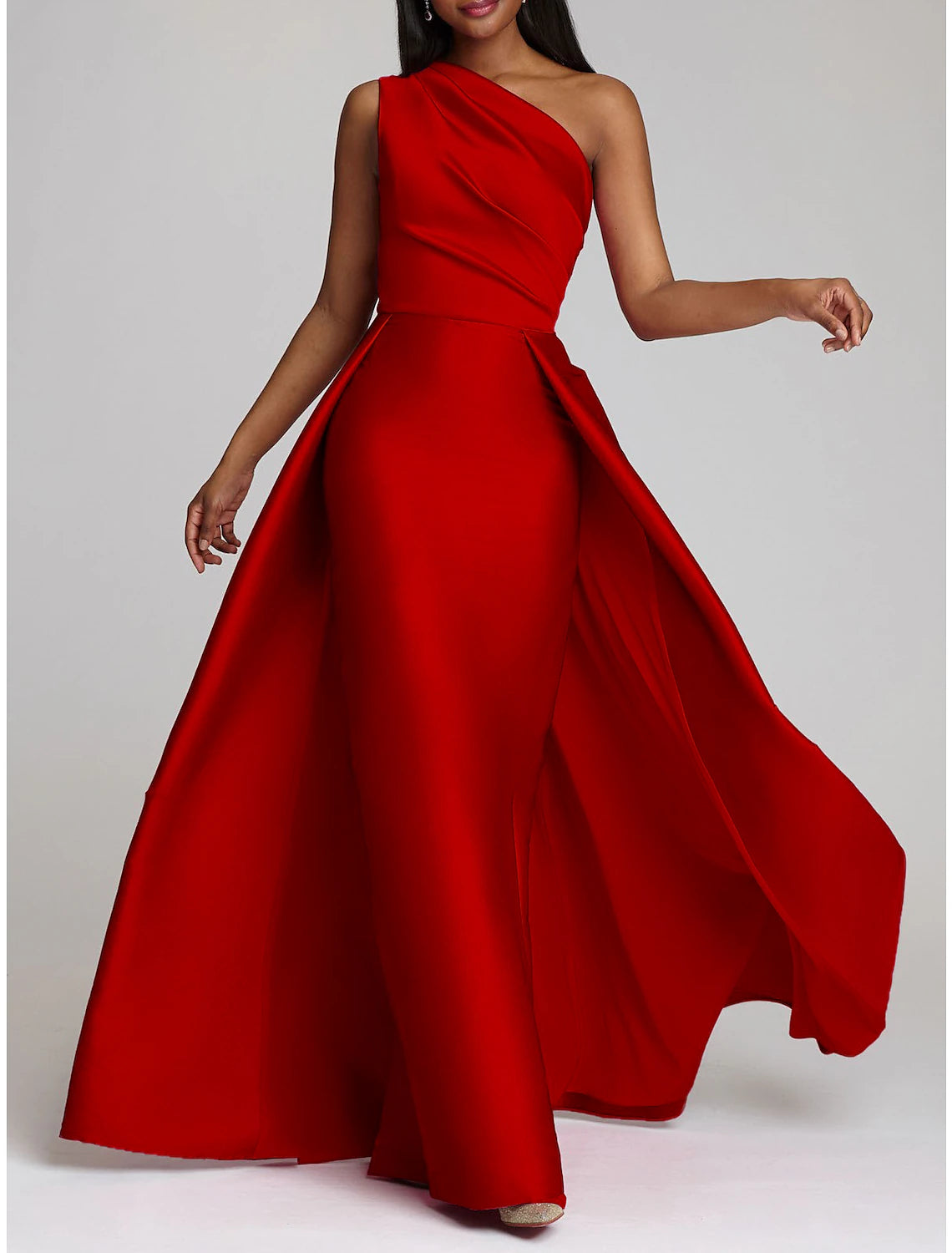 Close-up of the satin fabric and one-shoulder neckline of the evening gown.