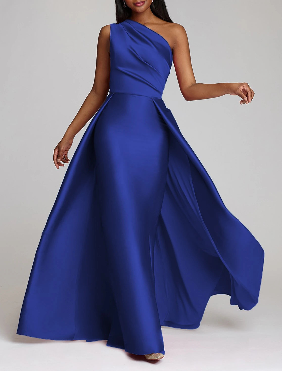 Full length view of the one-shoulder satin dress, showcasing its flow.