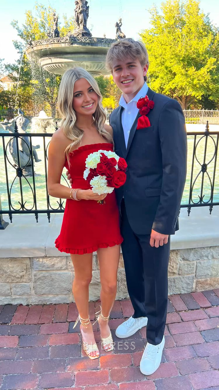 Front view of a model wearing a chic red strapless sheath short dress.