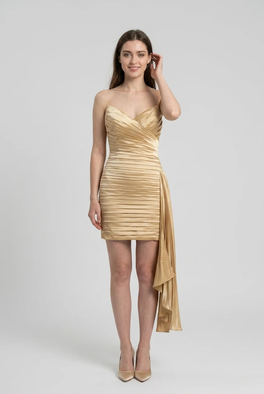 Woman in a sleeveless ruched homecoming dress, full length view.