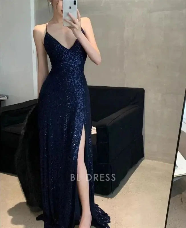 Front view of a woman in the navy blue sheath V-neck dress, showing the V-neckline.