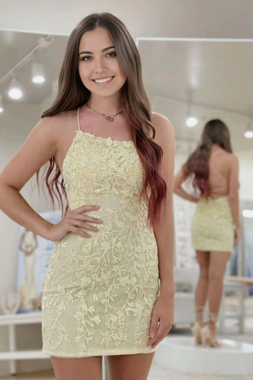 Short sheath dress with spaghetti straps and V-neckline.