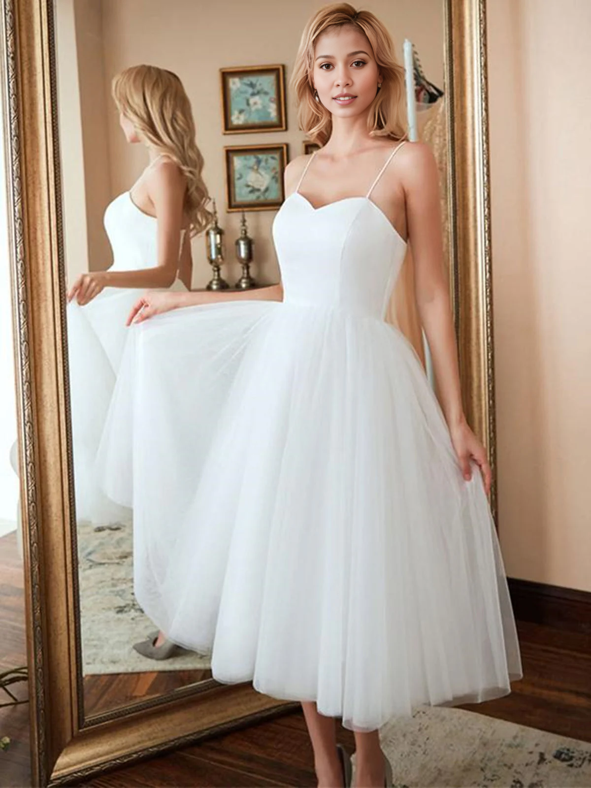 Front view of an A-line sweetheart tulle tea length wedding dress.