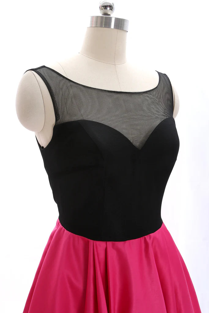 Side view of a model in a black A-line homecoming dress.
