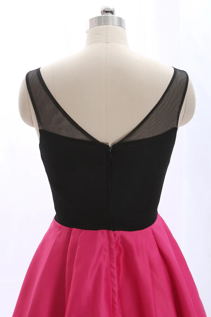 Back view of a black spaghetti strap mini dress on a model.