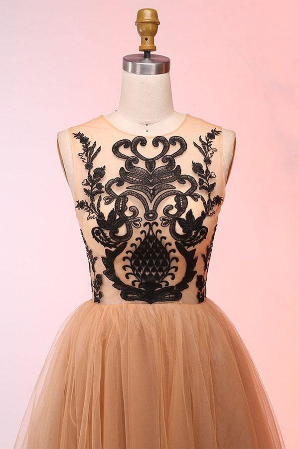 Close-up of the tulle appliques on a vintage-inspired short formal dress.