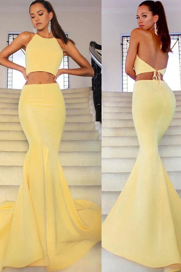 Pink two-piece mermaid prom dress with a high neck and a long skirt.