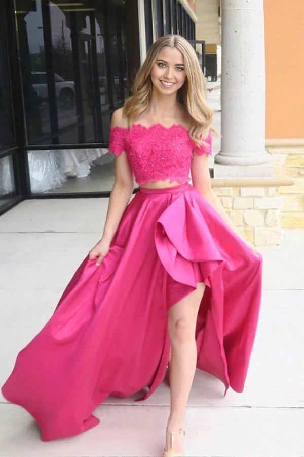 Model wearing a fuchsia two-piece off-shoulder prom dress with short sleeves and pockets.