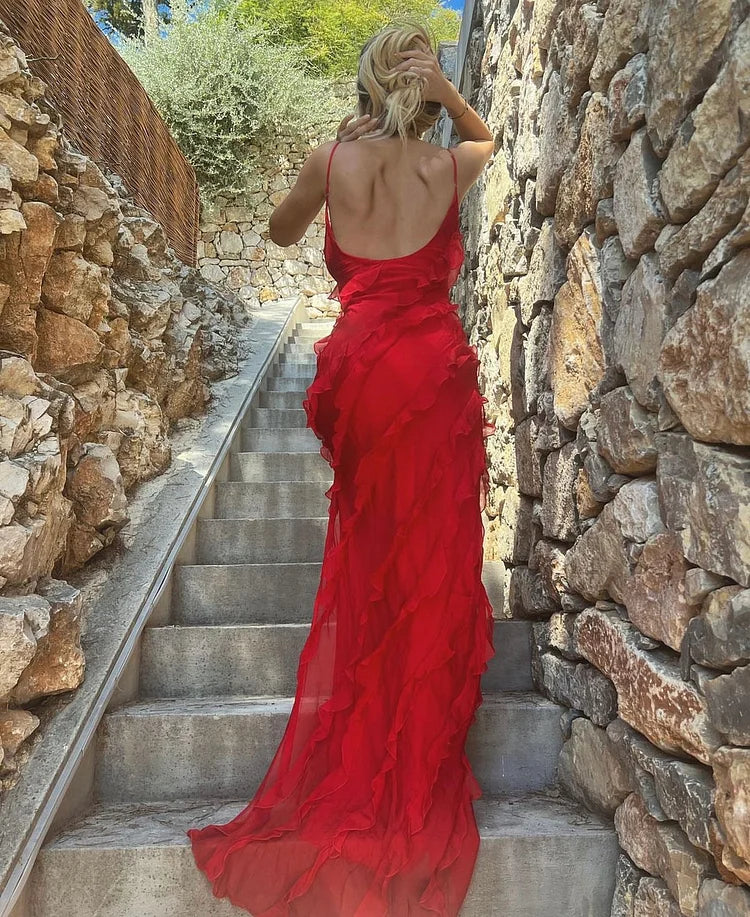 Back view of the backless spaghetti strap ruffled gown.