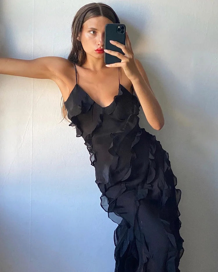 Close-up of the V-neckline and ruffled details on the prom dress.