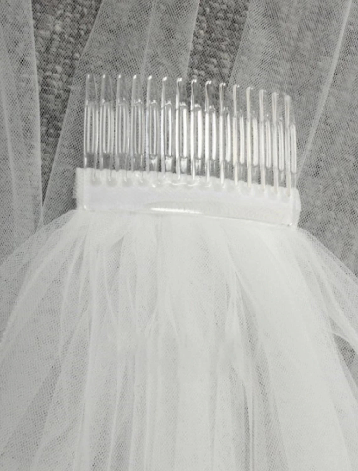 Close-up of the delicate two-tier tulle fabric of a wedding veil.