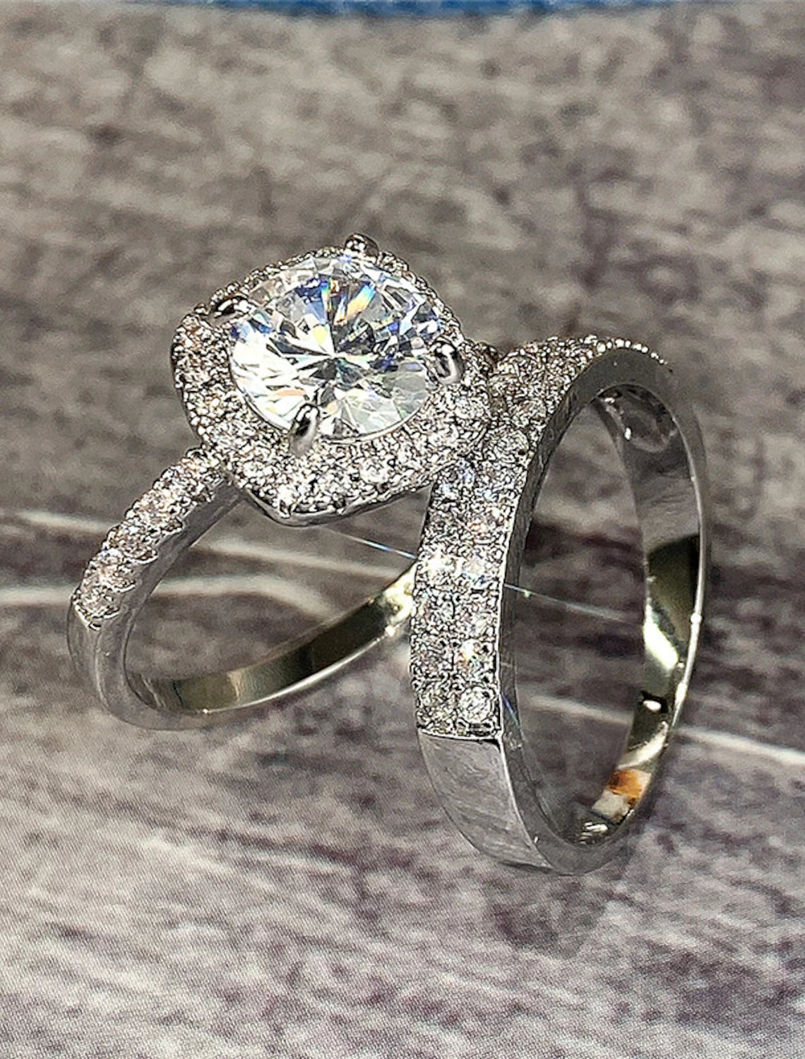 Zircon engagement ring with matching wedding band.