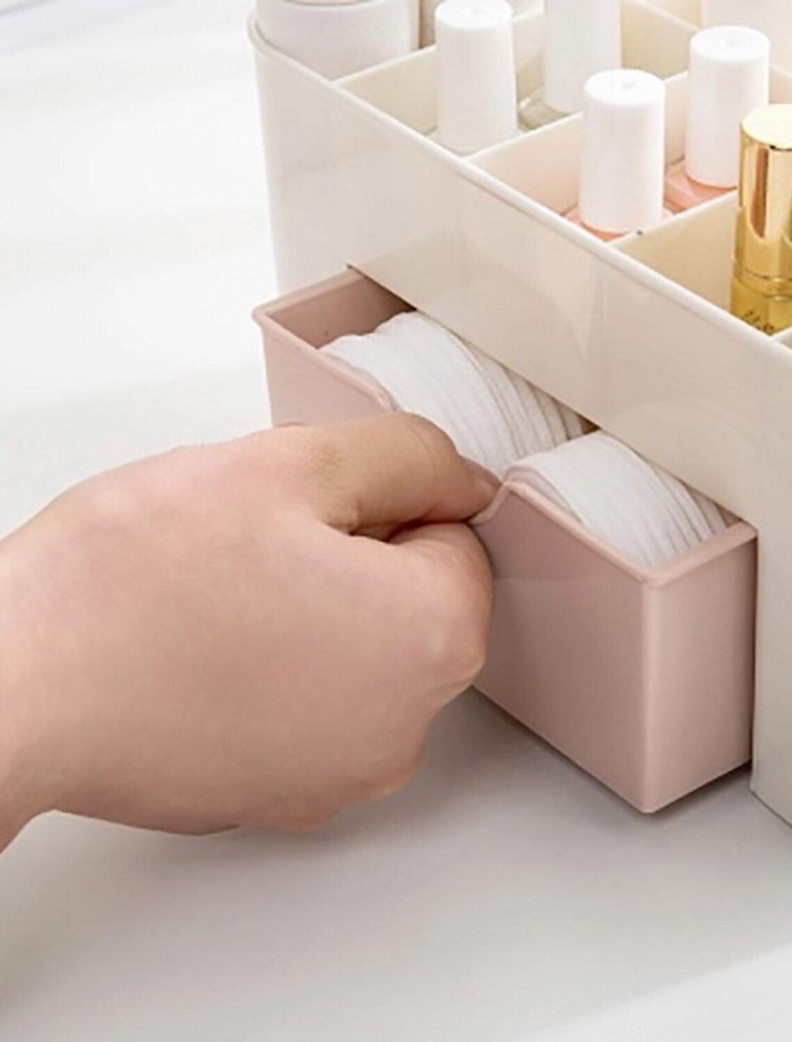 Top view of the multi-layer desktop organizer for beauty products.
