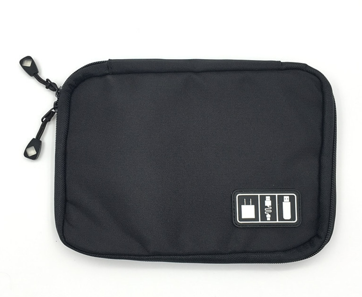 A pink portable cable organizer bag, open, with various digital accessories neatly stored inside.