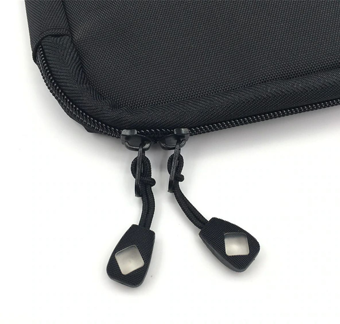 A grey portable cable organizer bag, open, showing elastic loops and mesh pockets.