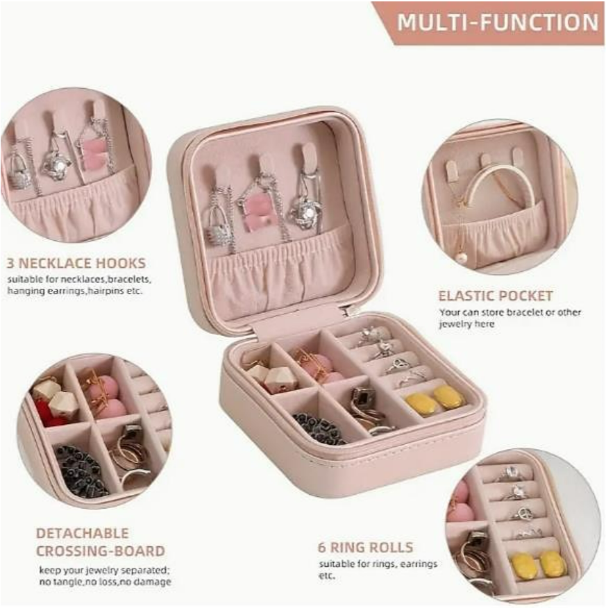 Interior of pink jewelry case with ring rolls and earring slots.
