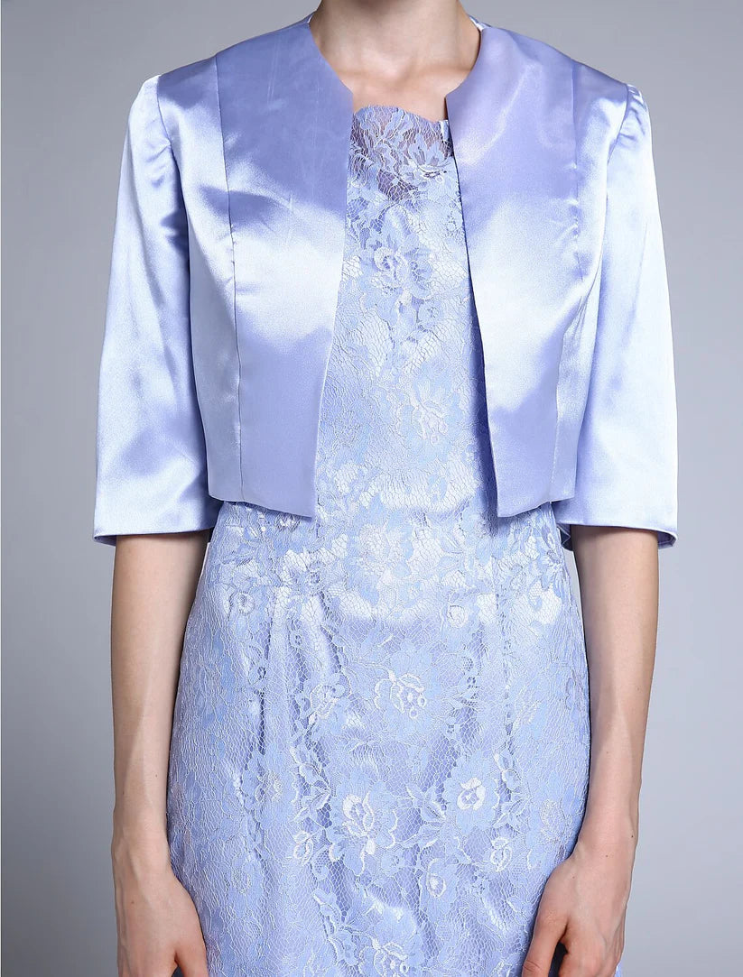 Close-up of the V-neckline and half sleeves of the satin lace Mother of the Bride dress.