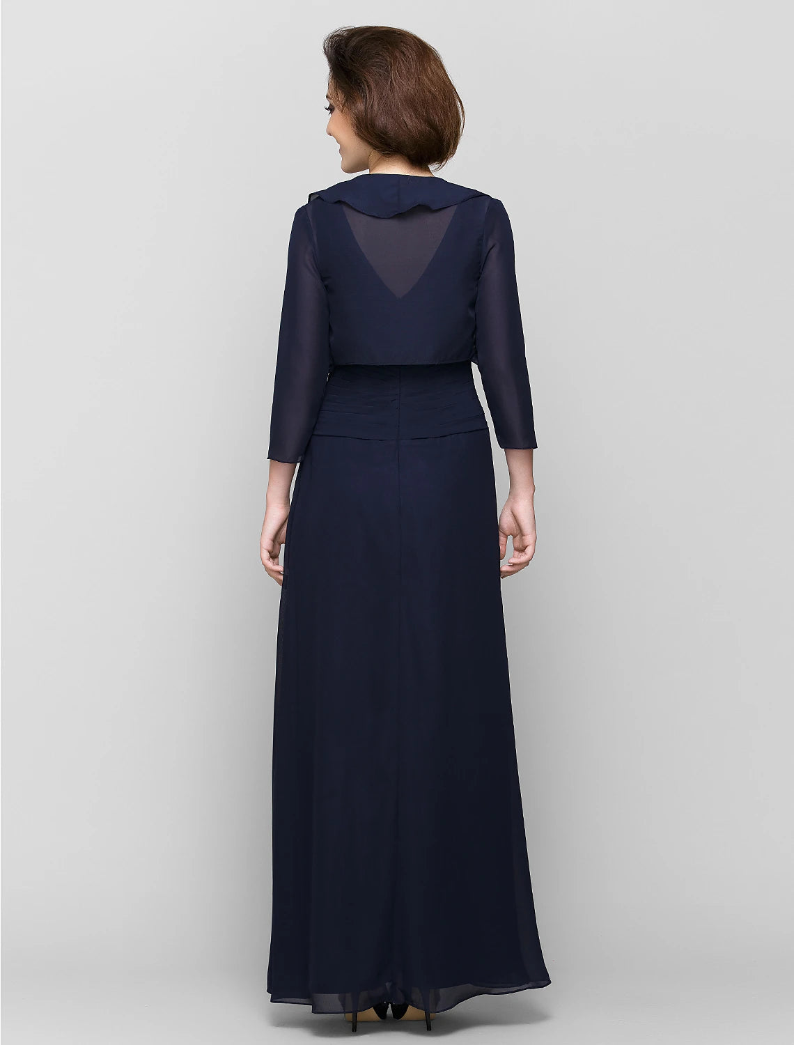 Side profile of the elegant V-neck Mother of the Bride gown.
